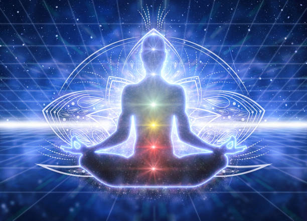 Silhouette of a person meditating in lotus pose with glowing chakra points along the spine against a blue geometric, mandala-like background.